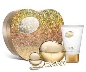 Gift Set Contains:  - Donna Karen DKNY Golden Delicious 50ml EDP Spray Women - Donna Karen DKNY Golden Miniature 7ml EDP Women - Donna Karen DKNY Golden Delicious Shimmering Body Lotion 100ml - Donna Karen DKNY Gold Keychain